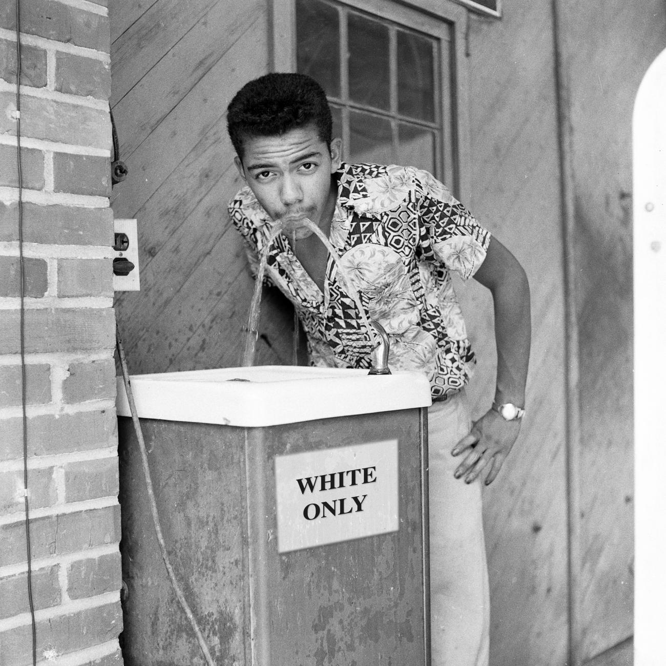 Cecil Williams Drinking from a White Only Water Fountain; 1956